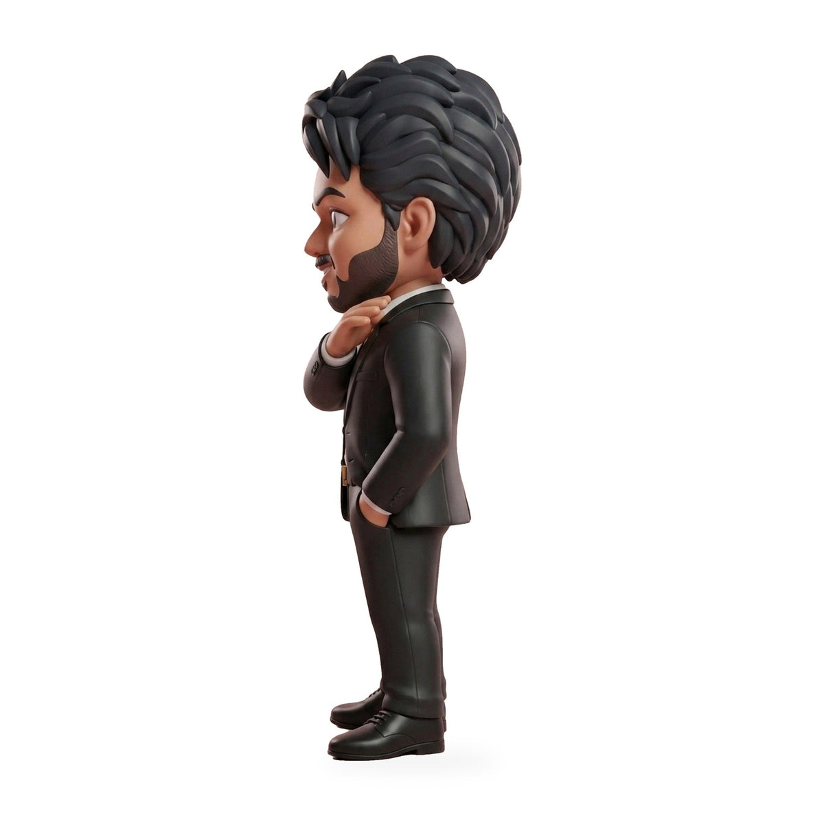 Side view of the CM Vijay figurine showing hairstyle, beard and black blazer