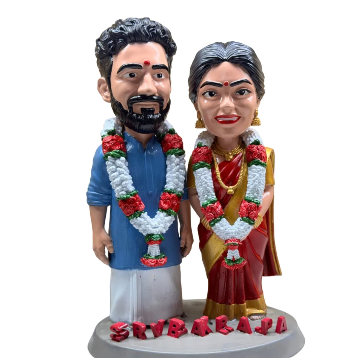 Bride and groom figurine in veshti and red silk saree on a nameplate base