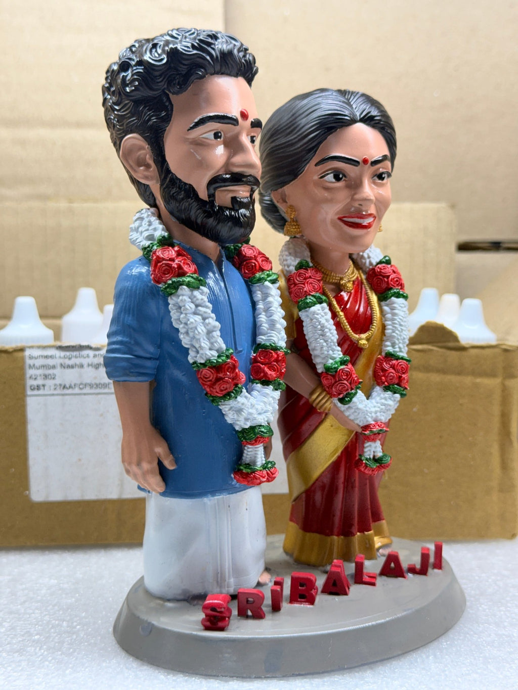 Angled view of the bride and groom wedding figurine made from a photo
