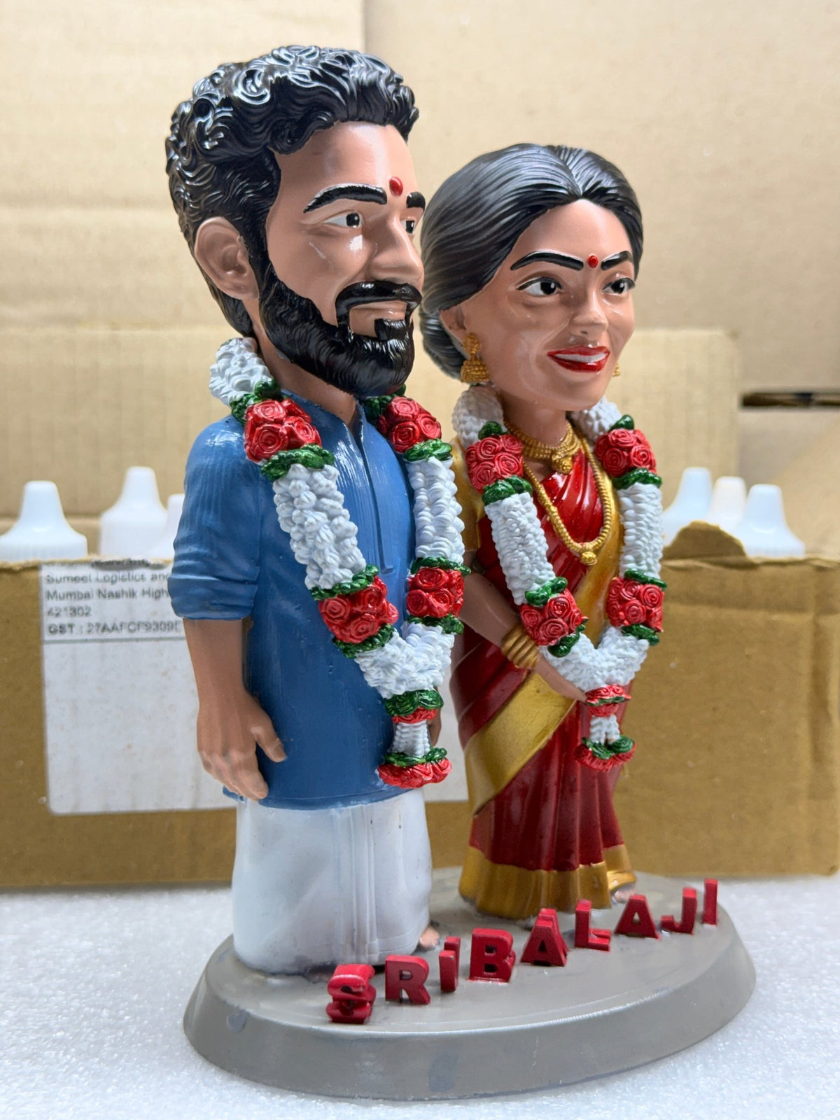 Angled view of the bride and groom wedding figurine made from a photo