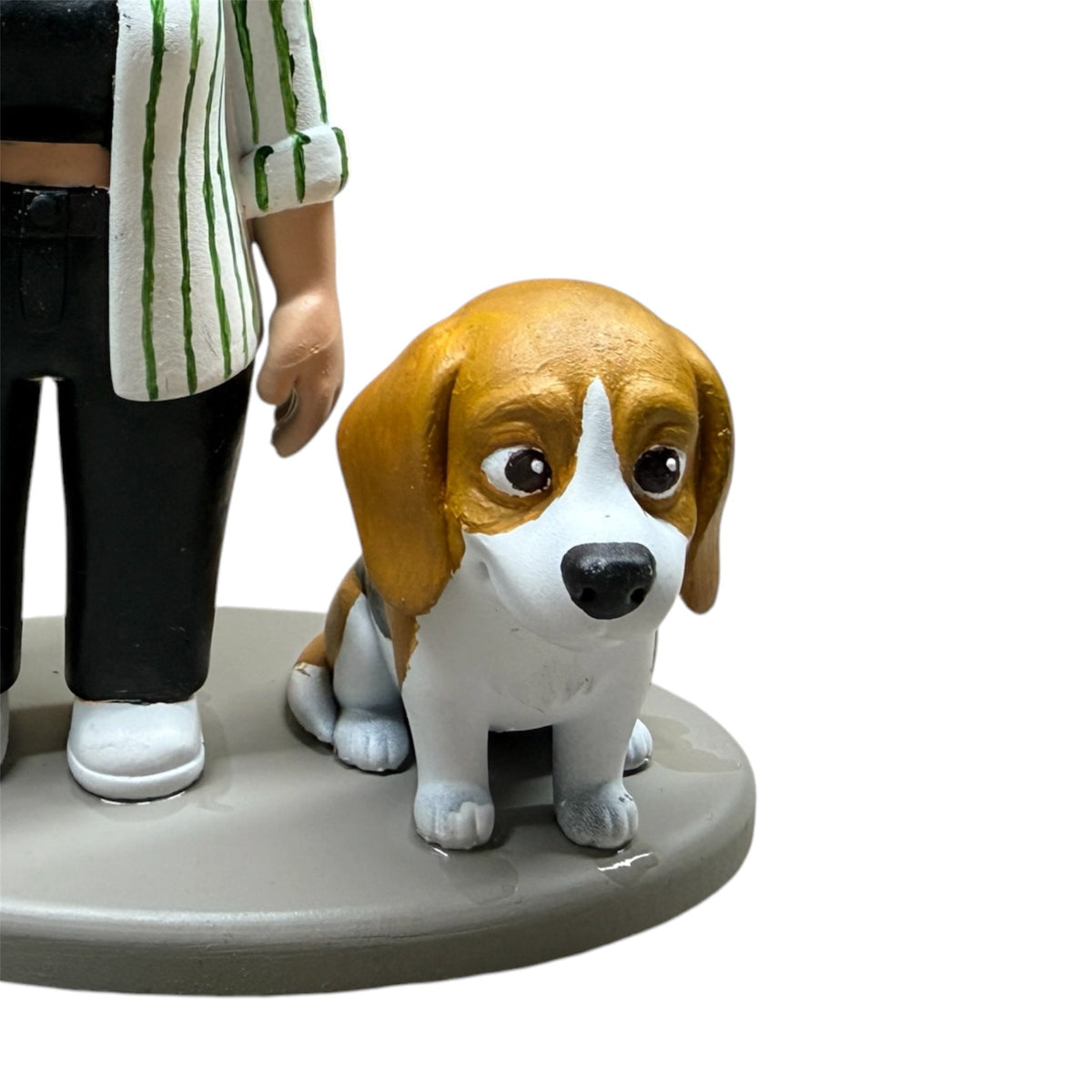 Beagle pet figurine standing beside its owner on a shared display base